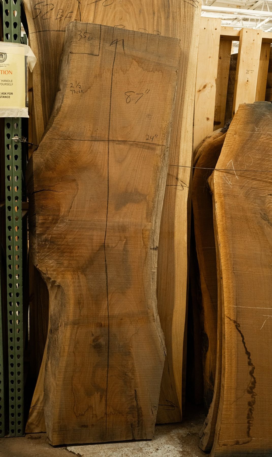 A tall kiln-dried live edge slab in our slab room